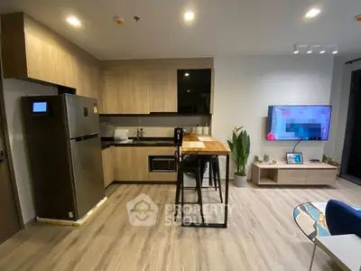 Modern kitchen and living area with stylish decor and open layout
