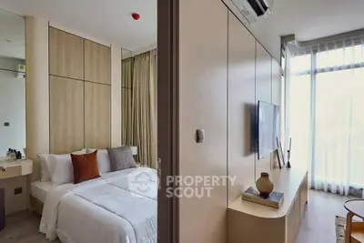 Modern bedroom with stylish decor and natural light in a contemporary apartment.