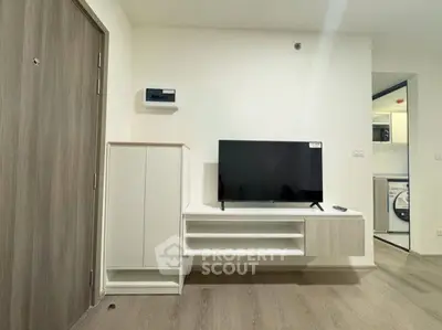 Modern living room with sleek TV unit and minimalist decor
