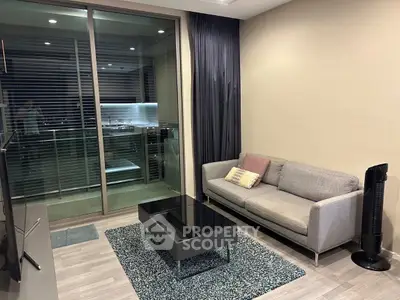 Modern living room with sleek furniture and balcony view