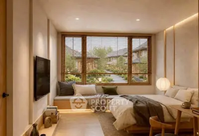 Cozy bedroom with large window offering serene garden view, featuring modern decor and ambient lighting.