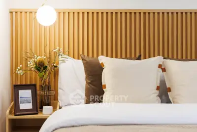 Cozy bedroom with modern wooden headboard and elegant decor