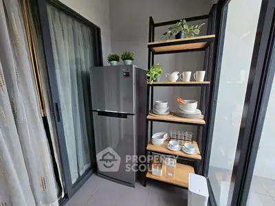 Modern kitchen corner with sleek fridge and stylish shelving unit