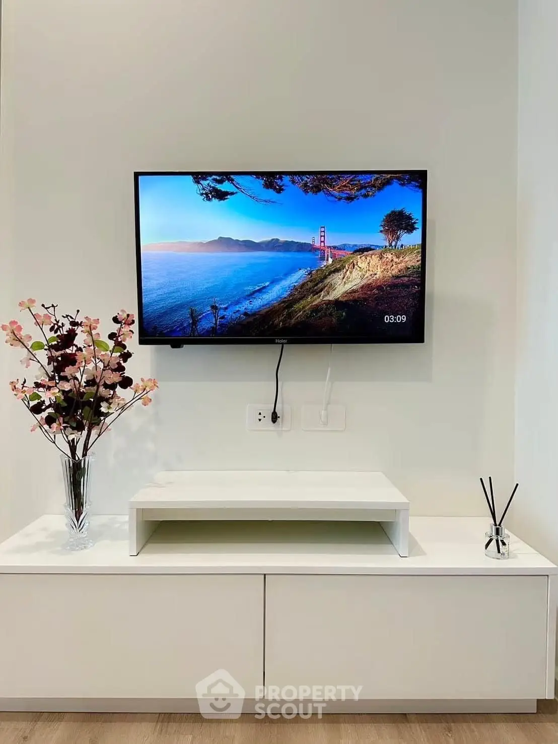 Modern living room with wall-mounted TV and stylish decor