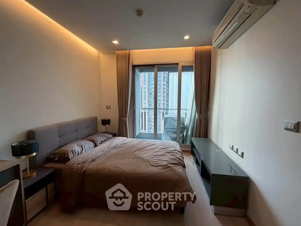 Modern bedroom with balcony view in high-rise apartment