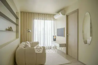 Modern minimalist living room with cozy sofa, wall-mounted TV, and large window with sheer curtains.
