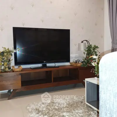 Stylish living room with modern TV stand and cozy decor