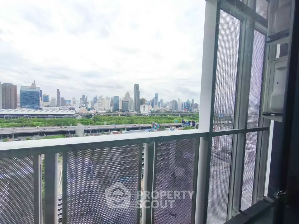 Stunning cityscape view from modern balcony with panoramic skyline.
