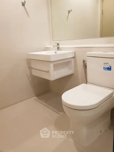 Modern bathroom with sleek fixtures and neutral tones