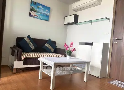Charming living room with cozy sofa, modern decor, and air conditioning in a stylish apartment.