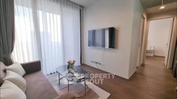 Modern living room with sleek TV and elegant decor