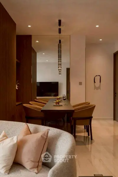 Elegant dining area with modern decor and cozy seating in a stylish apartment.