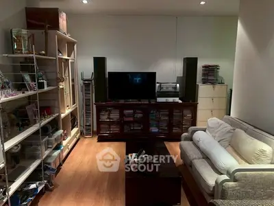 Cozy living room with modern entertainment center and comfortable seating