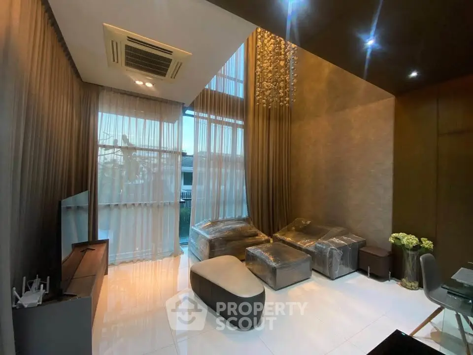 Luxurious modern living room with high ceilings and elegant decor