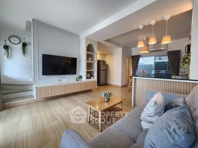 Spacious modern living room with open kitchen and stylish decor