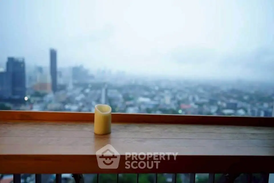 Stunning cityscape view from a high-rise balcony with a serene ambiance.