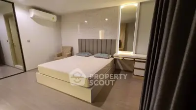 Modern bedroom with stylish decor and cozy lighting