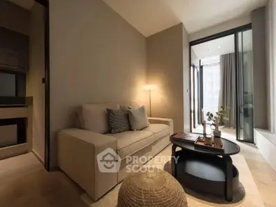 Modern living room with cozy sofa and stylish decor, perfect for relaxation.