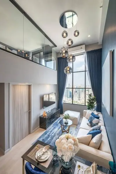 Luxurious modern living room with high ceilings and city view, featuring elegant decor and stylish lighting.