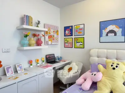 Charming bedroom with cozy decor, plush toys, and vibrant wall art, perfect for a playful and inviting atmosphere.