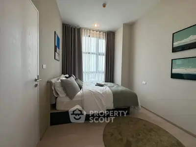 Cozy modern bedroom with stylish decor and natural light