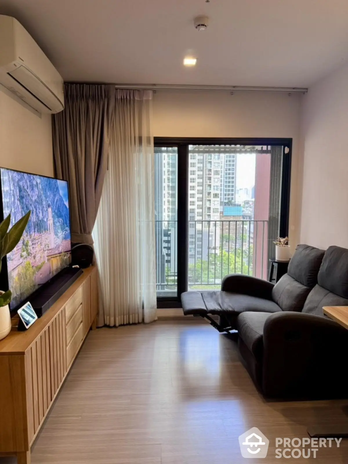 Modern living room with balcony view in urban apartment