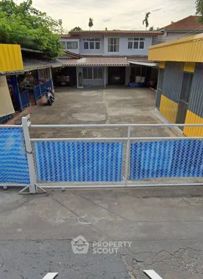 Spacious residential property with ample outdoor space and secure fencing, ideal for family living.