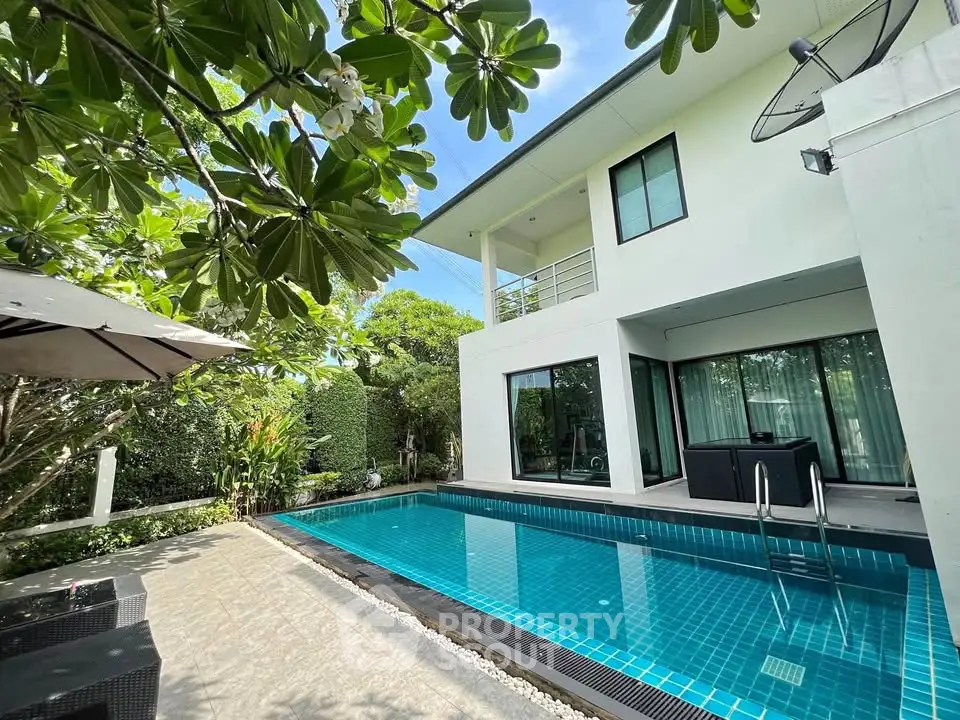 Luxurious modern villa with private pool and lush garden, perfect for serene living.