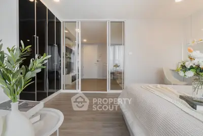 Modern bedroom with glass partition and elegant decor
