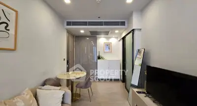 Modern living room with stylish decor and cozy seating area, perfect for relaxation and entertainment.