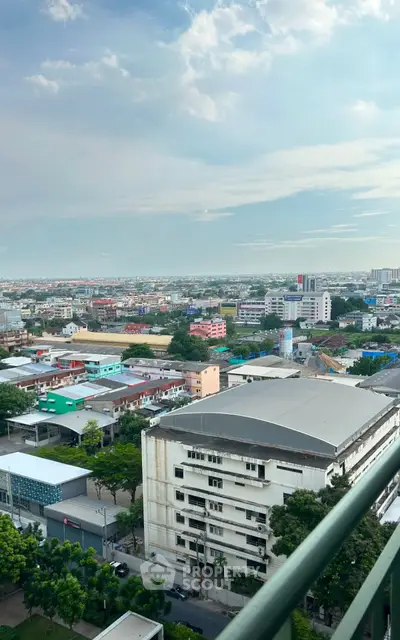 Stunning panoramic city view from a high-rise balcony, showcasing urban landscape and skyline.