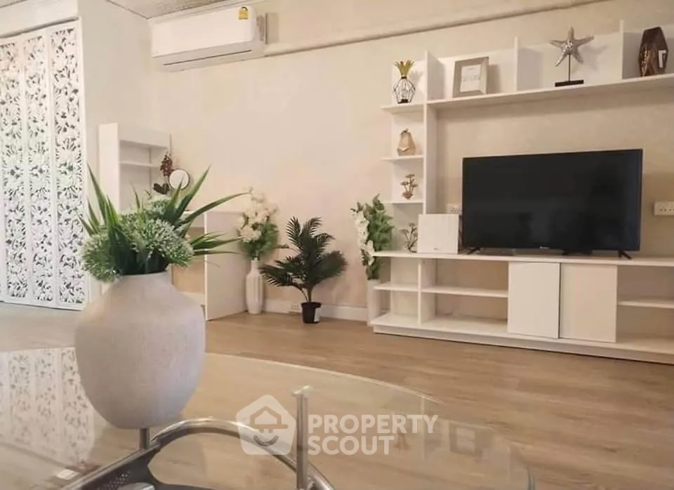 Modern living room with stylish decor and entertainment center