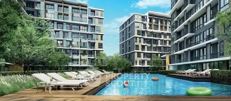 Luxurious modern apartment complex with inviting pool and sun loungers, perfect for relaxation and leisure.