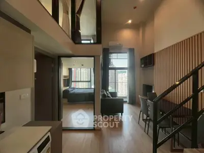Modern duplex apartment with open living area and stylish interior design