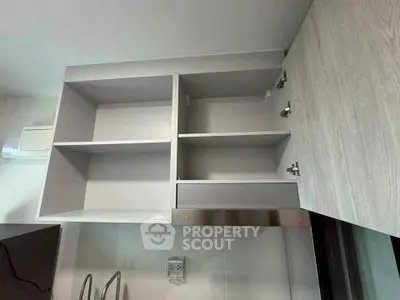 Modern kitchen cabinet with open shelves and sleek design