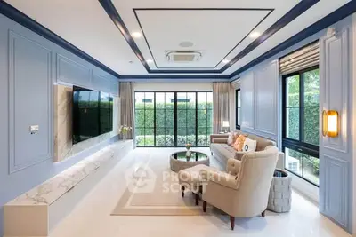 Luxurious living room with elegant decor and large windows offering garden views.