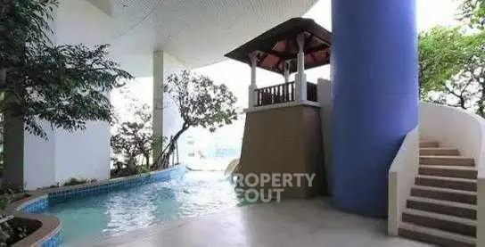 Luxurious building with pool and modern architecture, perfect for relaxation and leisure.