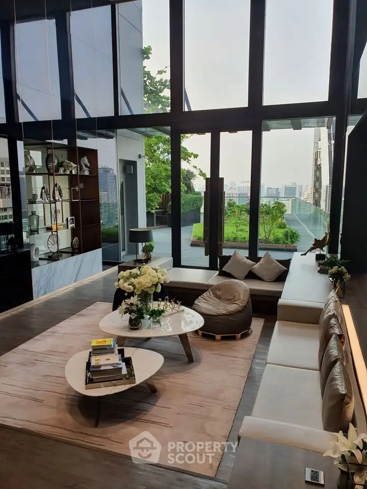 Luxurious modern living room with floor-to-ceiling windows and stunning city view.