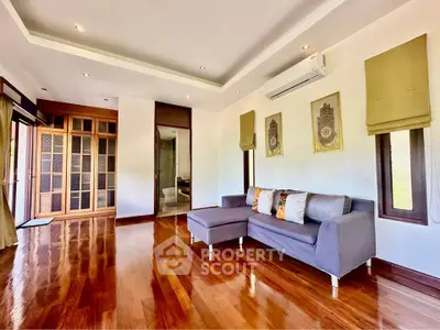Spacious living room with wooden flooring and modern decor
