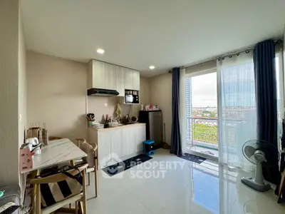 Modern kitchen with open layout and balcony view in stylish apartment