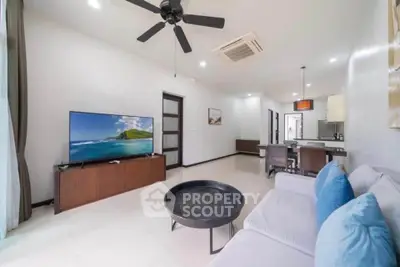 Spacious modern living room with sleek design and open kitchen layout