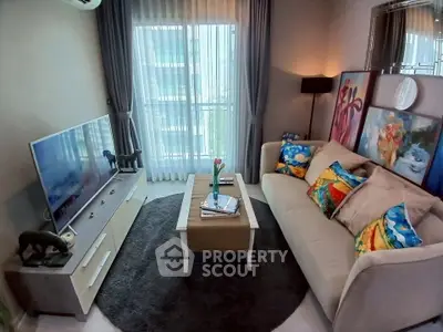 Cozy living room with modern decor, large window, and stylish furniture in a high-rise apartment.