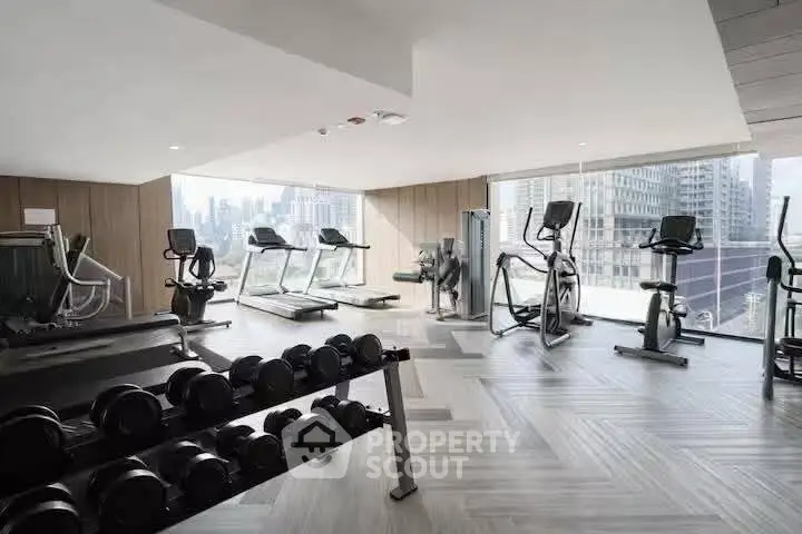 Modern gym with city view in luxury residential building