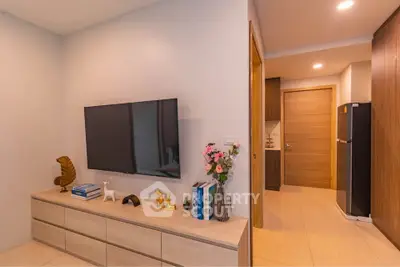 Modern living room with wall-mounted TV and stylish decor