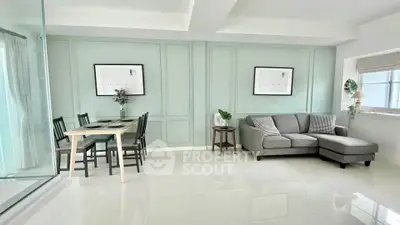 Modern living room with elegant dining area and stylish decor