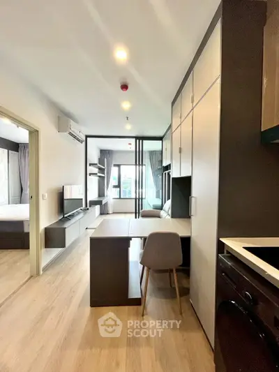 Modern apartment interior with open layout, featuring stylish furniture and natural light.