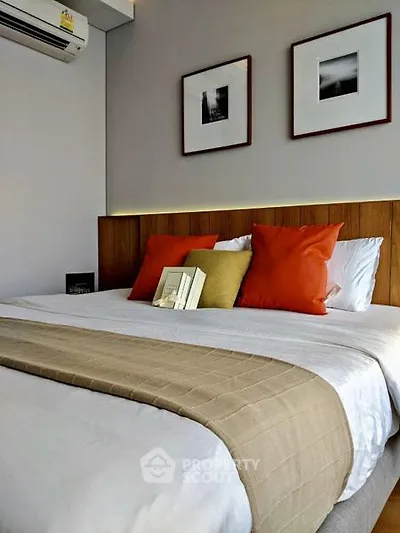 Cozy bedroom with stylish decor and modern air conditioning unit