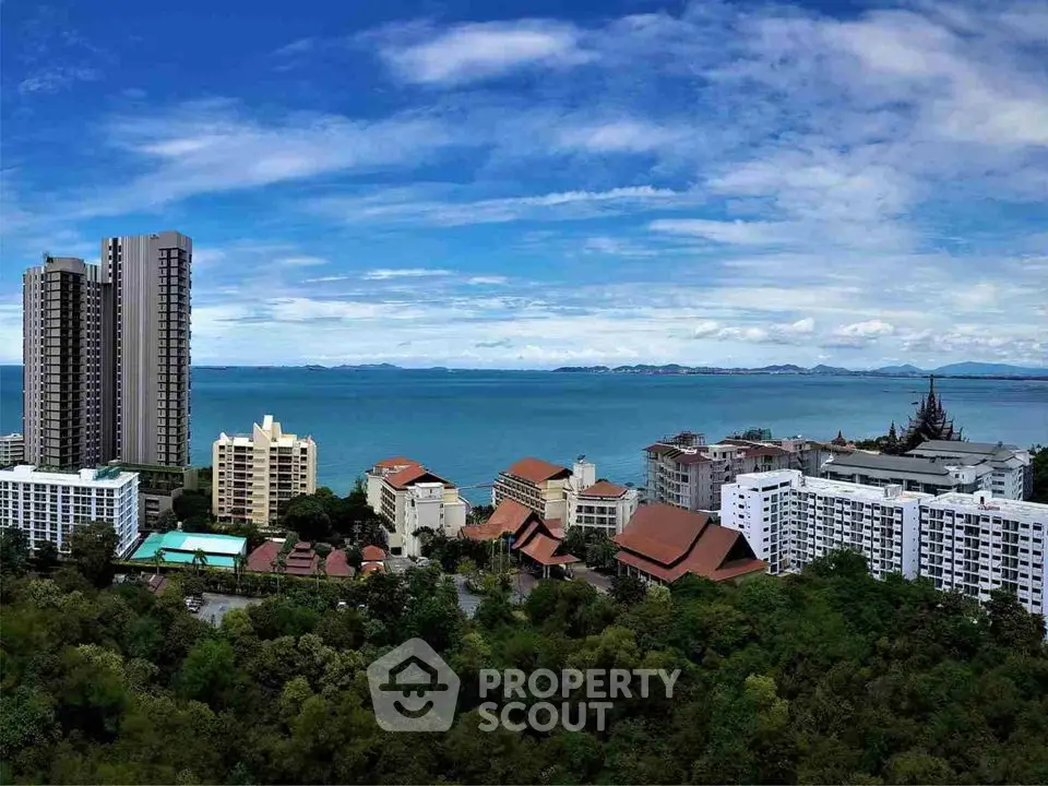 Stunning coastal view with modern high-rise buildings and lush greenery