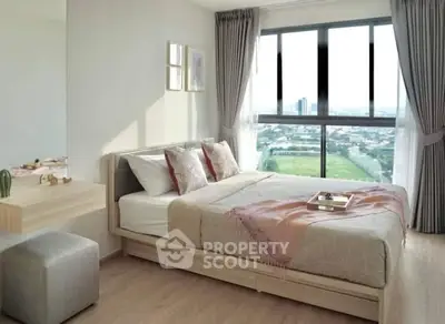 Modern bedroom with large window offering stunning city view, elegant decor, and cozy ambiance.