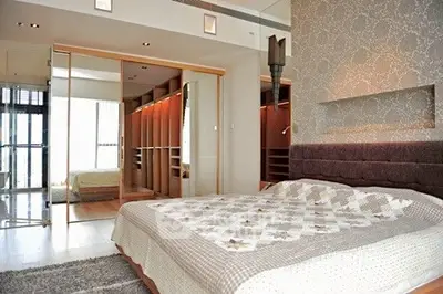 Luxurious bedroom with elegant decor and spacious walk-in closet